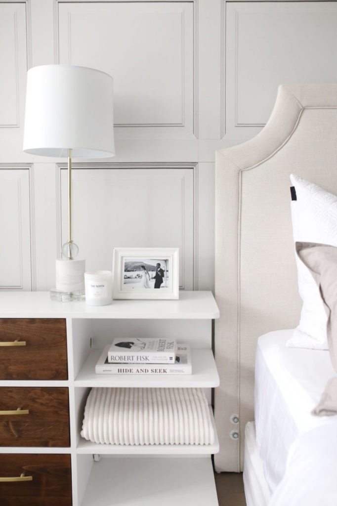 Bedroom space designed by Jillian Harris showing The Parlour Wallpaper manufactured and sold by Milton & King with white bed linens and light brown accents